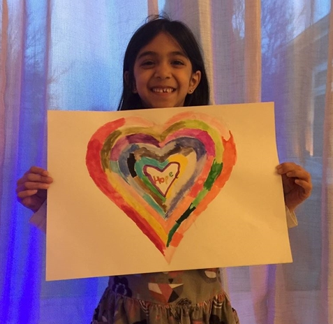 Junior School pupil with rainbow heart